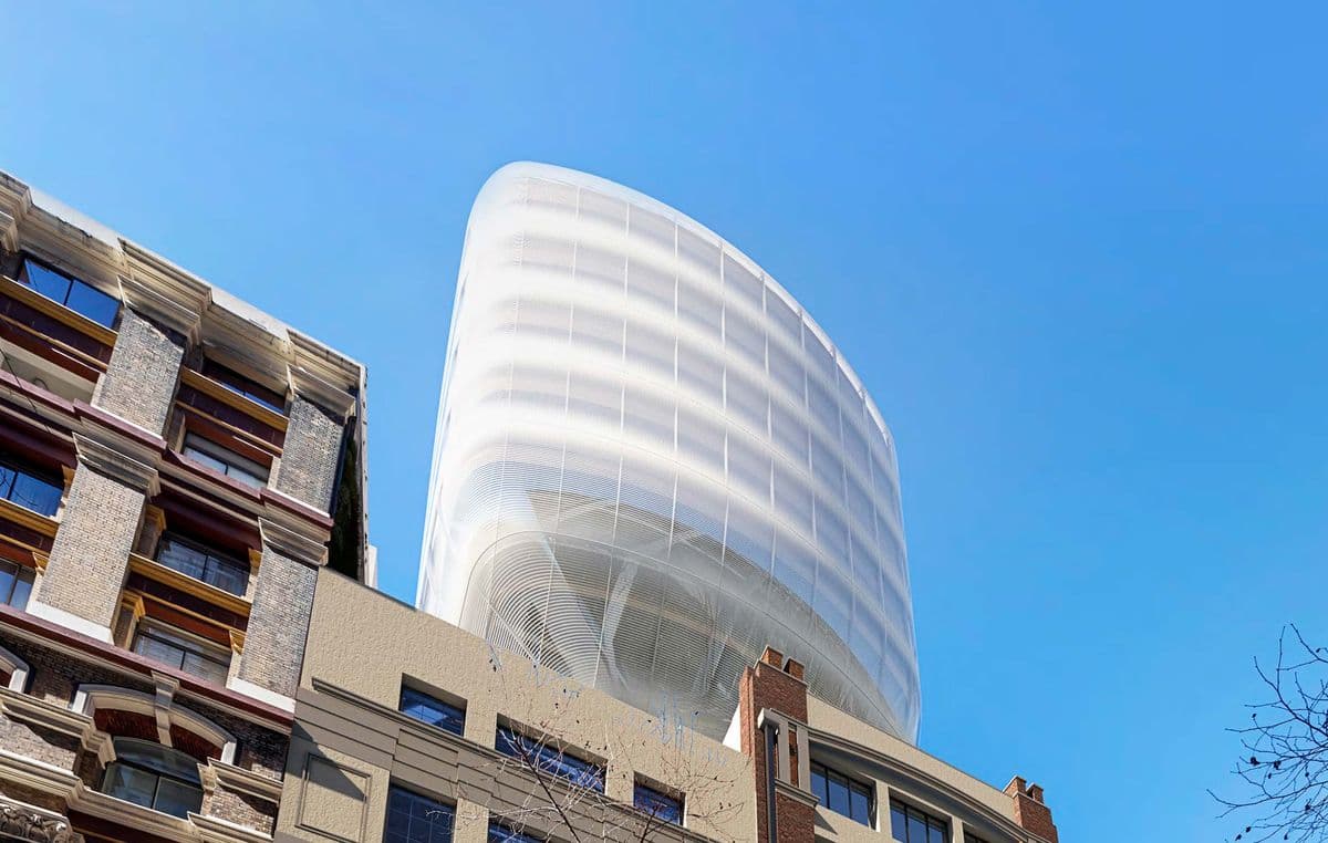 The completed glass cloud viewed from below against a clear blue sky