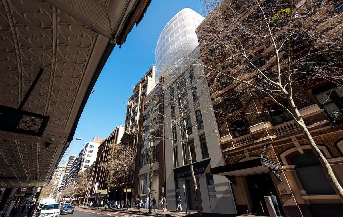 Looking along Clarence Street, the glass addition visible above the heritage streetscape