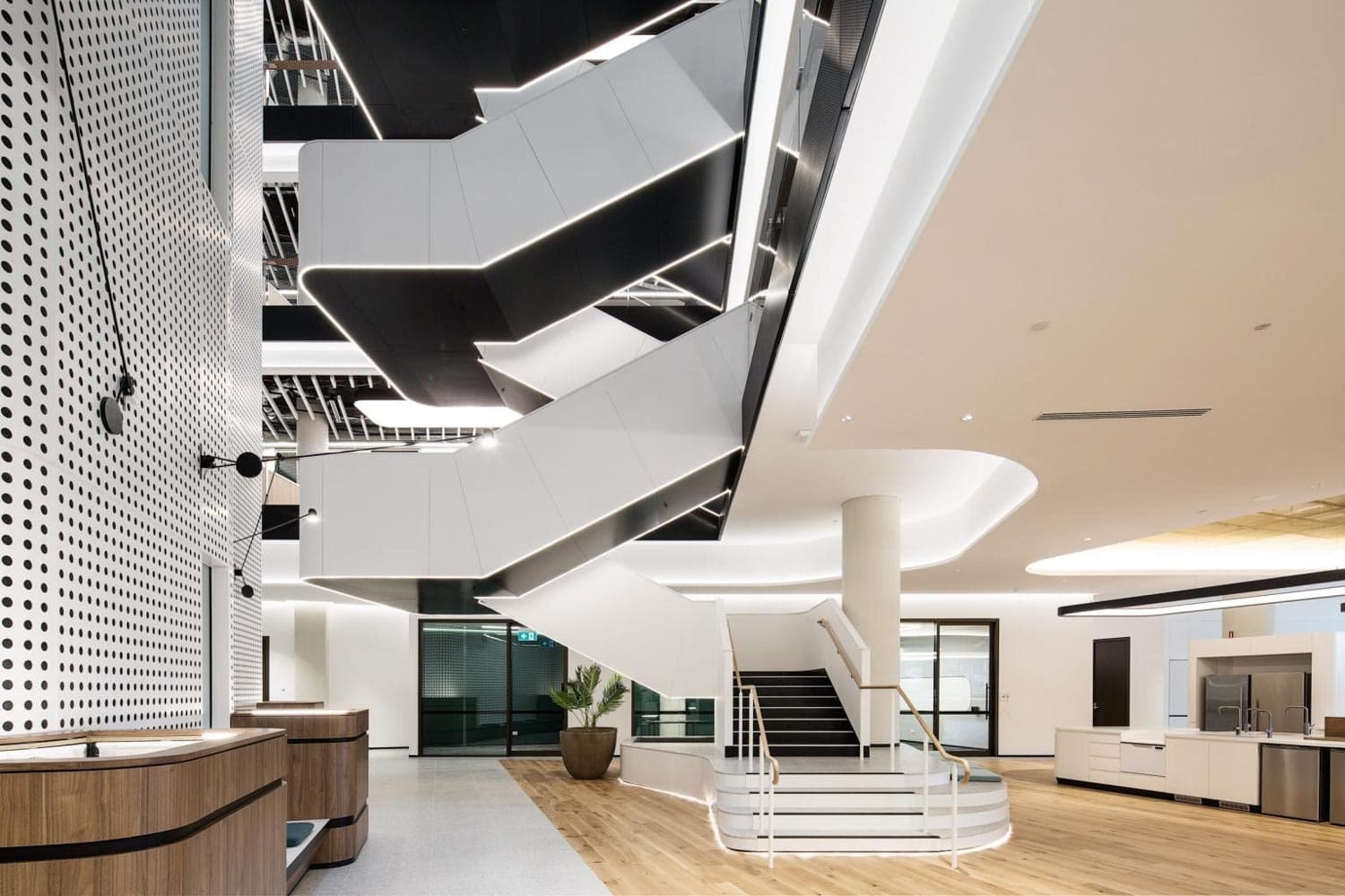 The Glasshouse, entry lobby with sculptural interconnecting stair and timber reception