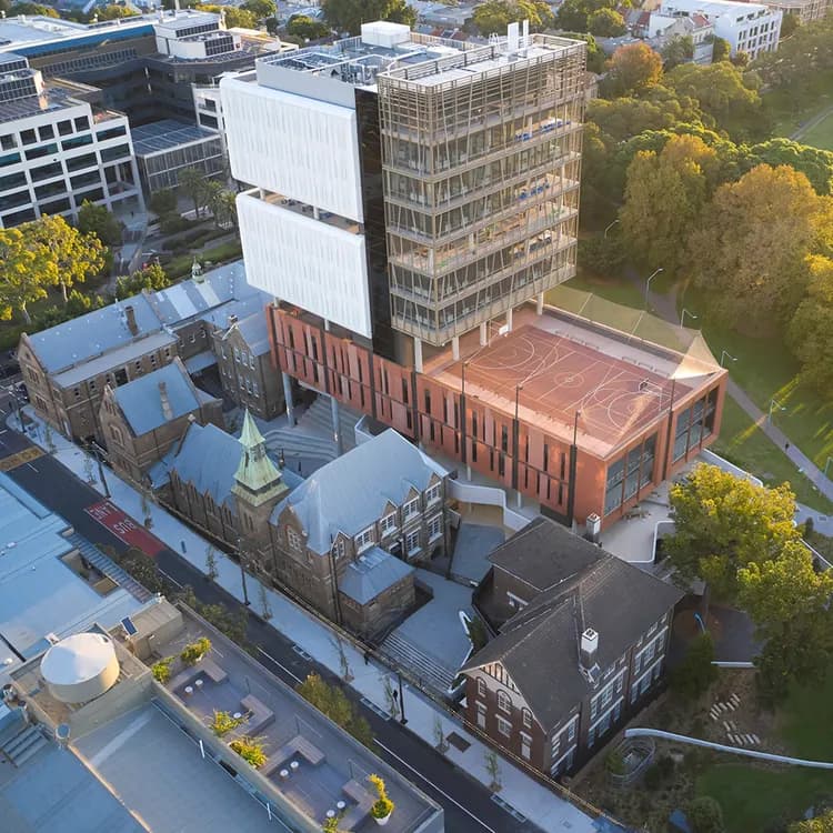 Inner Sydney High School, aerial view showing rooftop sports court, heritage precinct and tower