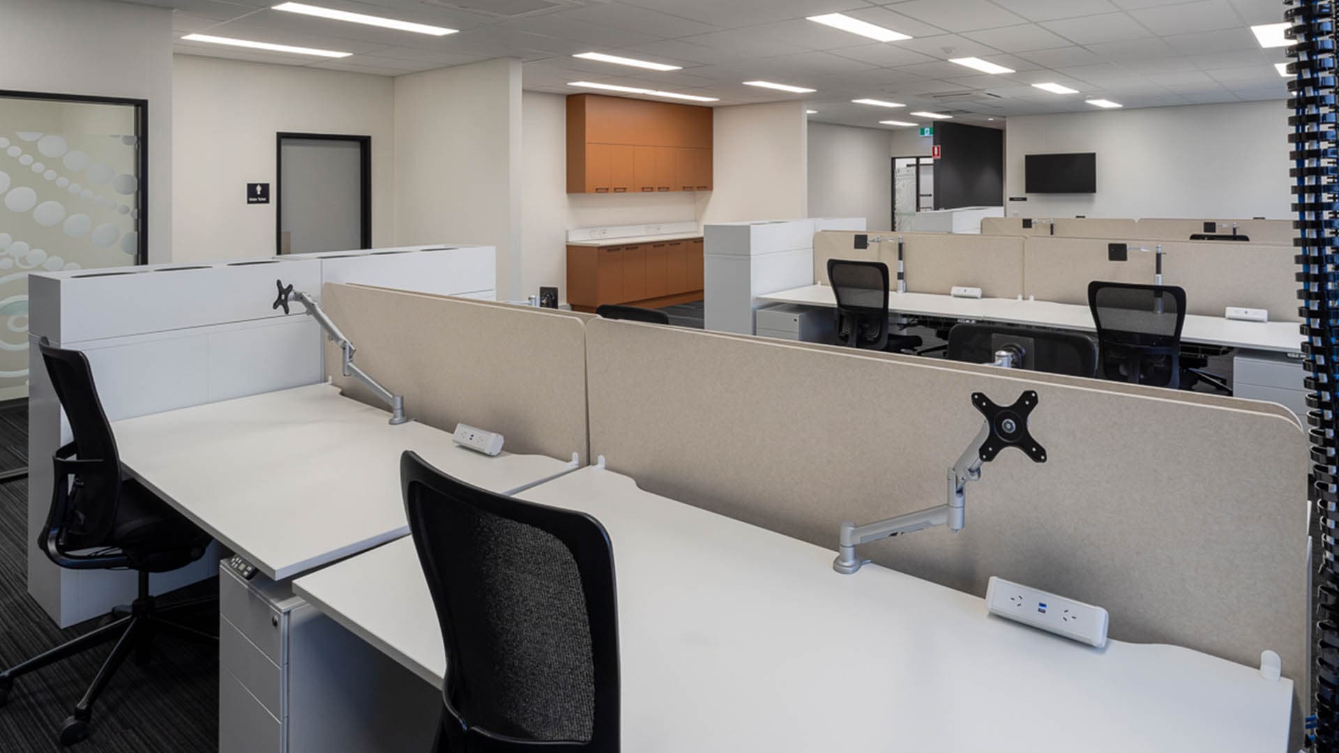 Open-plan staff office, upper level with new workstations, AV and breakout joinery