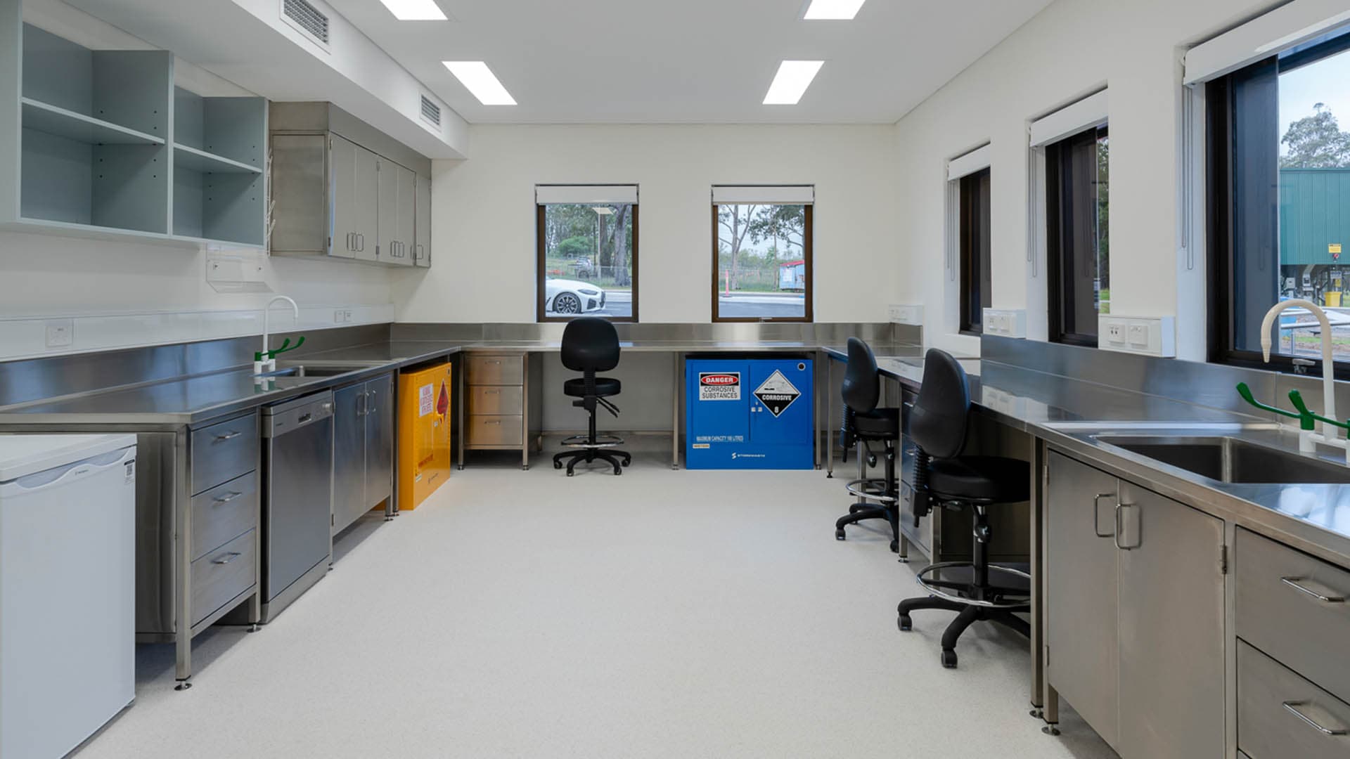 Site laboratory, stainless steel benching, chemical storage and operational workspace