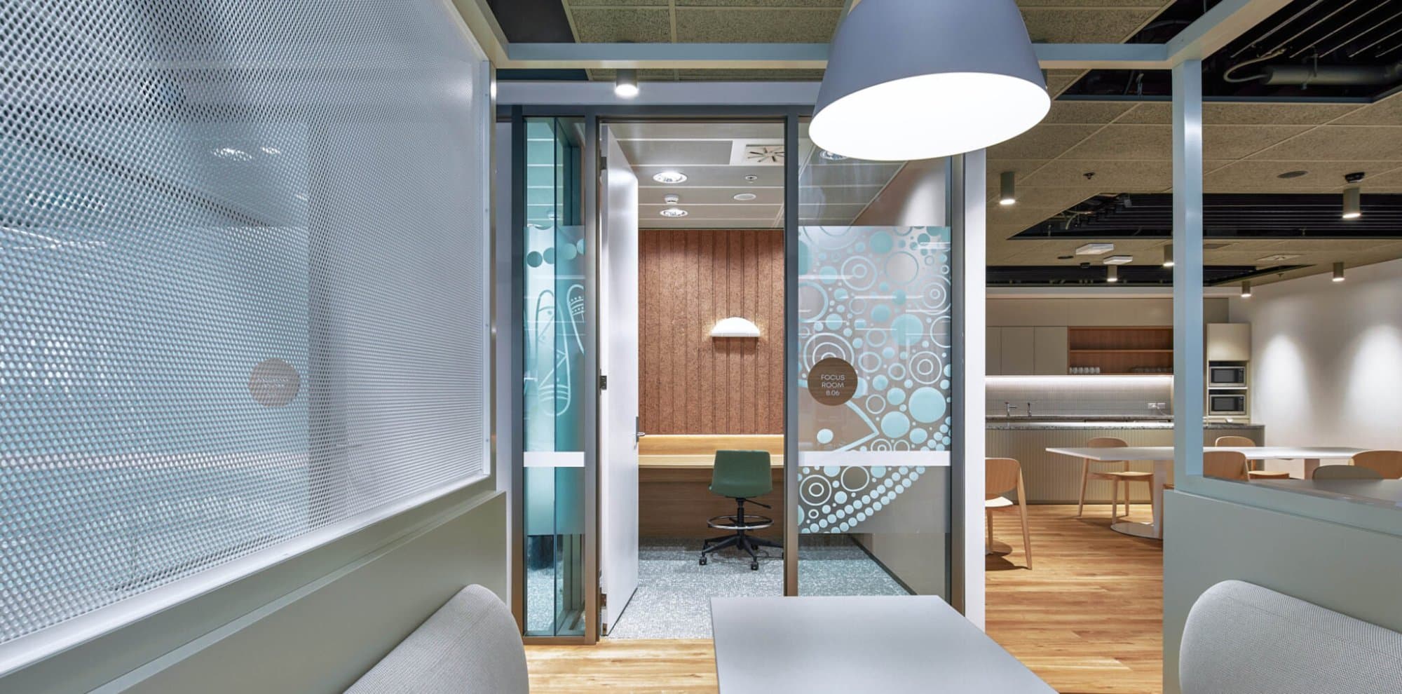 Sydney Water HQ, focus rooms and quiet work pods with bespoke graphics and breakout kitchen