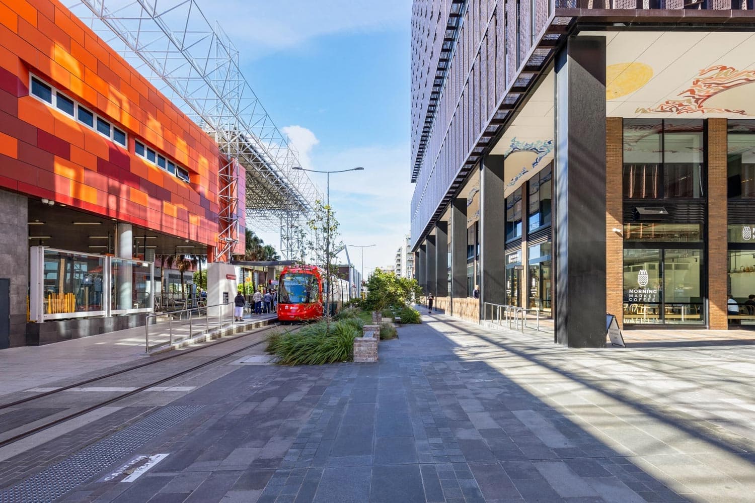 The Store Newcastle at street level, the building and light rail precinct along Stewart Avenue