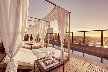 Vibe Hotel rooftop pool and bar with Sydney skyline