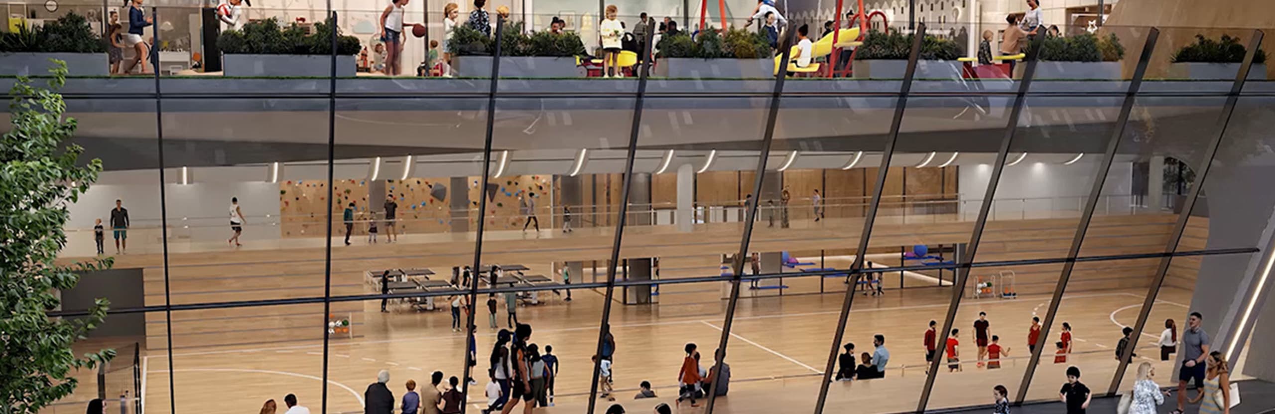 Render of the community sports facility with indoor courts, climbing wall, and rooftop recreation space