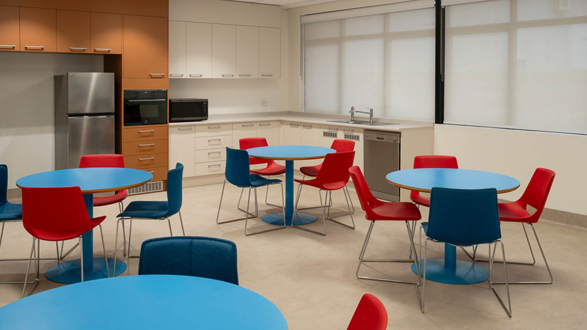 Staff kitchen and breakout, colourful furniture and full kitchen fitout on lower level