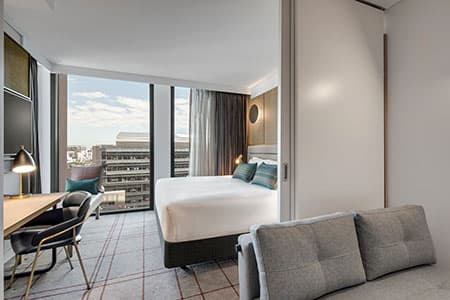 Vibe Hotel room interior with New York-inspired design